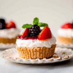Dreamy No Bake Cheesecake Mini Desserts Now 13 no bake cheesecake mini desserts garnished with berries and mint on a plate