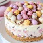 mini egg cheesecake with Cadbury mini eggs on cake stand for spring