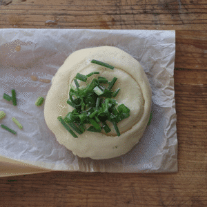 Rolled dough spiral filled with chopped scallions