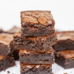 Cottage Cheese Brownies You Need Right Now 13 Stack of fudgy cottage cheese brownies on white background