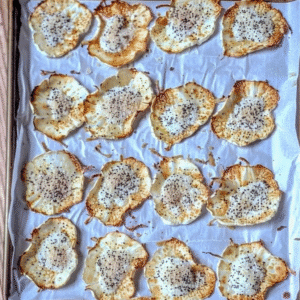 Freshly baked cottage cheese chips on parchment paper