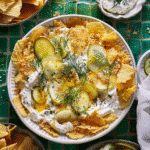 Viral Fried Pickle Dip: The Best Snack for Pickle Lovers 13 Viral fried pickle dip topped with sliced pickles, chips, and fresh dill