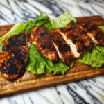 How to Make the Famous Earls Cajun Chicken Recipe at Home 9 Sliced earls cajun chicken recipe with charred crust served on lettuce